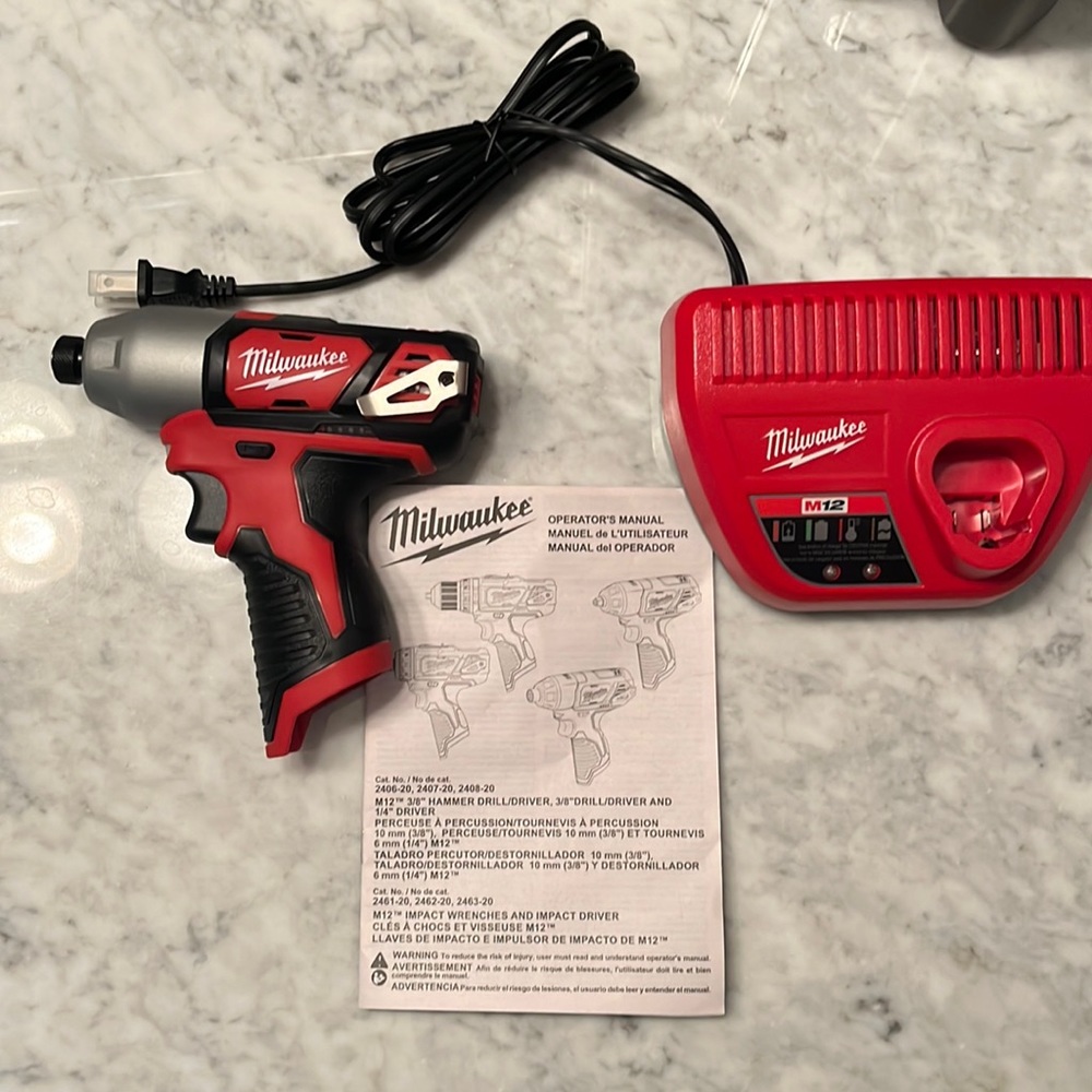 New Milwaukee Impact Driver and Battery Charging Base (Battery not included)